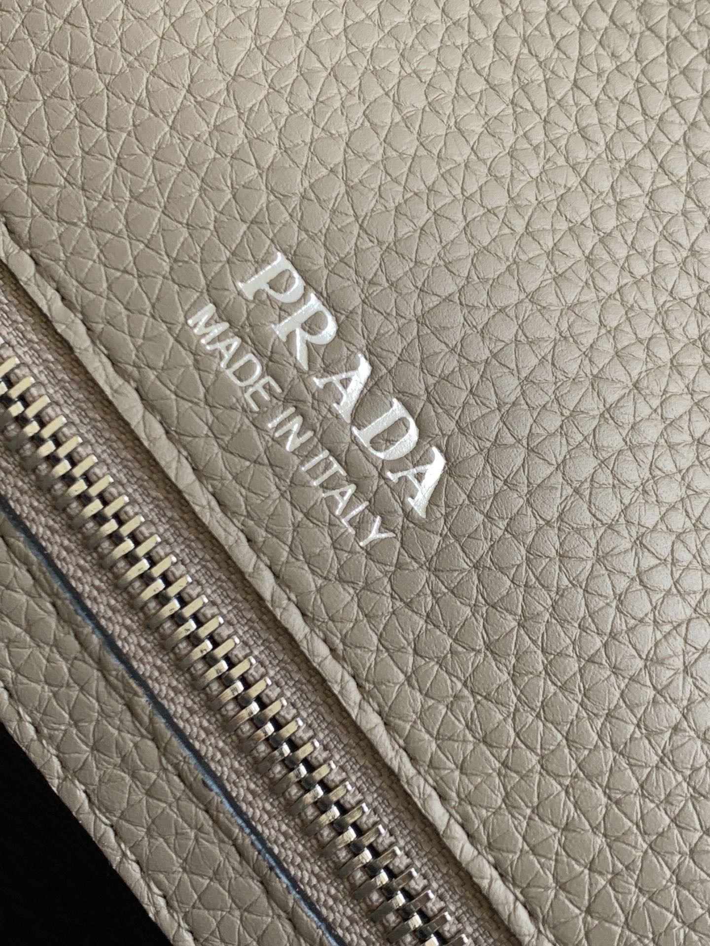 Pra*a flap shoulder bag in grey grained leather