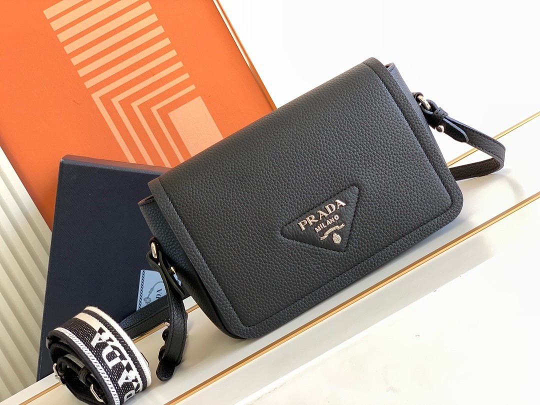 Pra*a flap shoulder bag in black grained leather