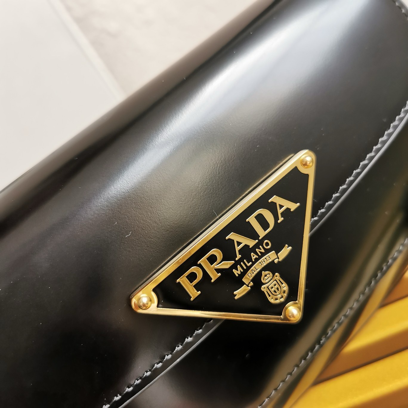 Pra*a shoulder bag in black brushed calfskin