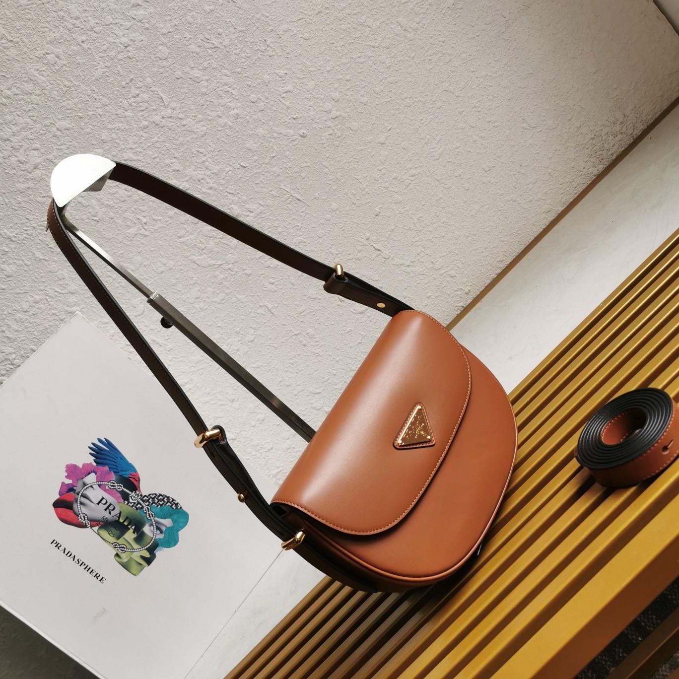 Pra*a arque shoulder bag with flap in brown leather