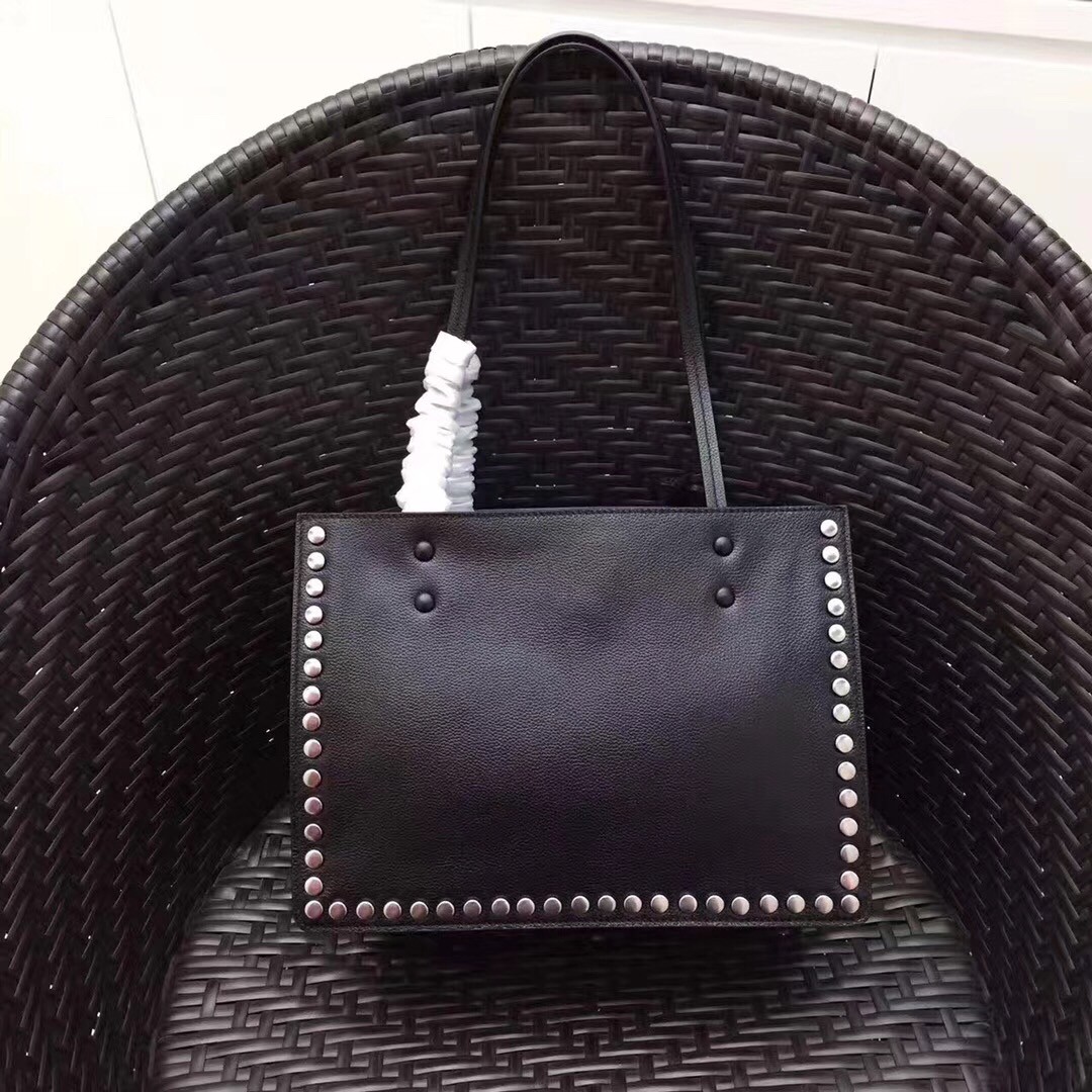Pra*a black etiquette calfskin tote with metal stud trim