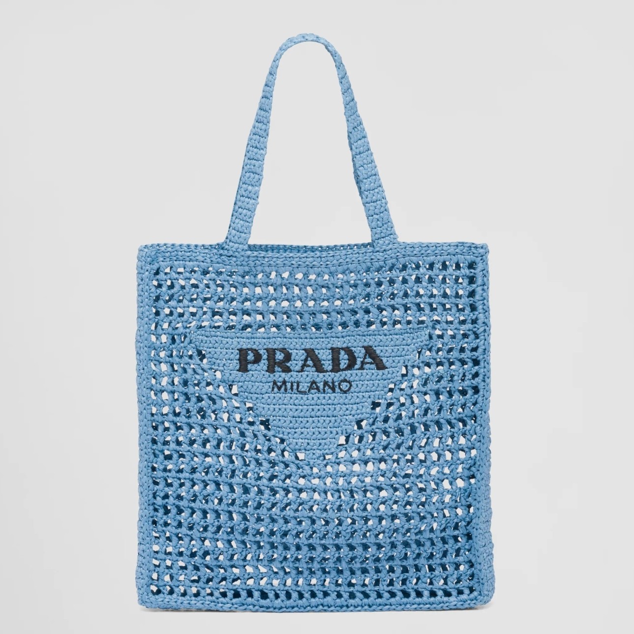 Pra*a small tote bag in blue woven raffia