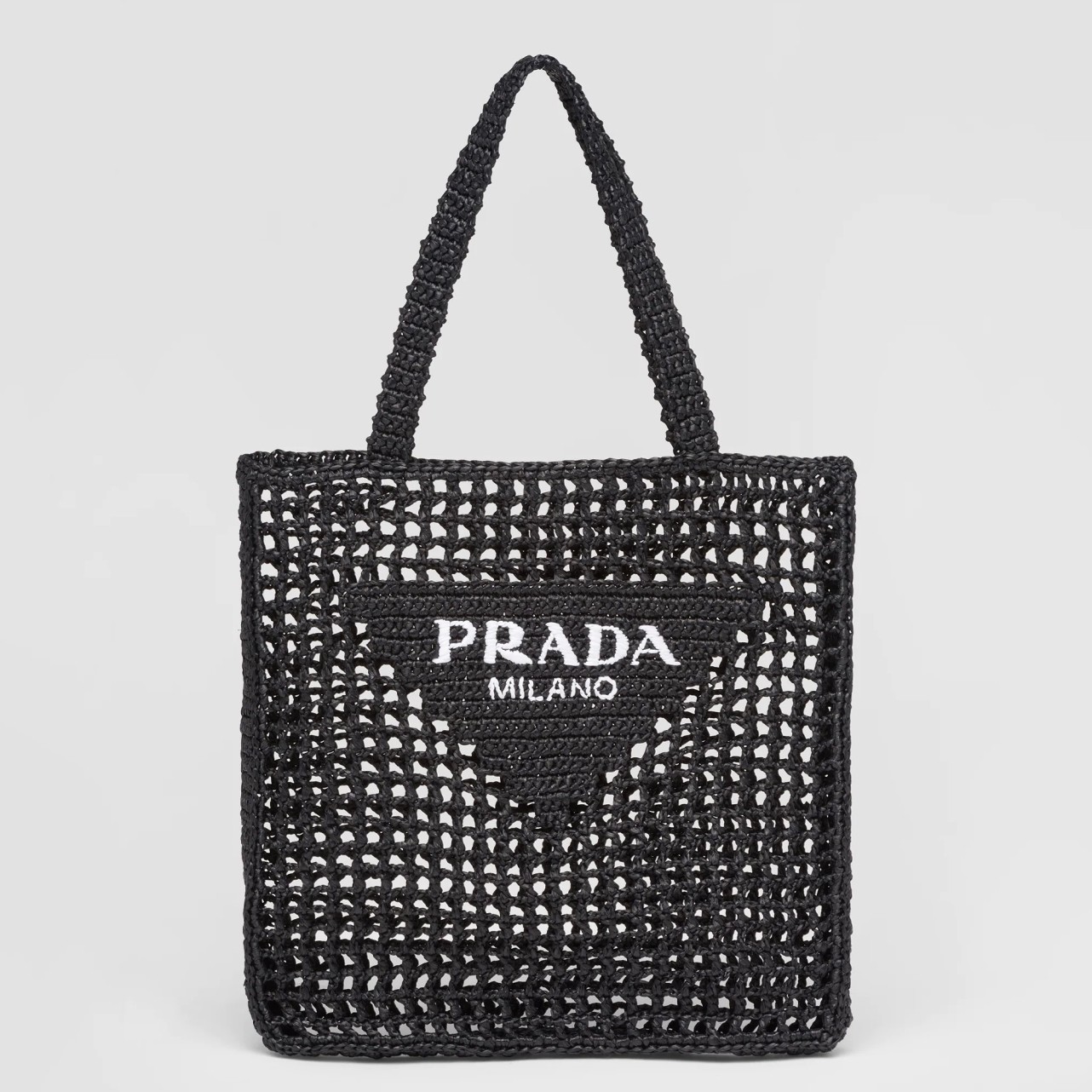 Pra*a small tote bag in black woven raffia