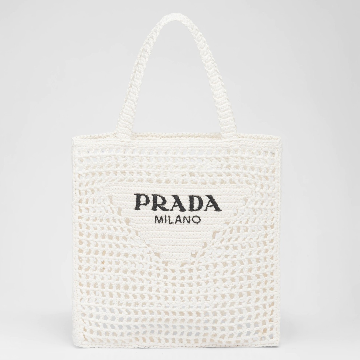 Pra*a small tote bag in white woven raffia