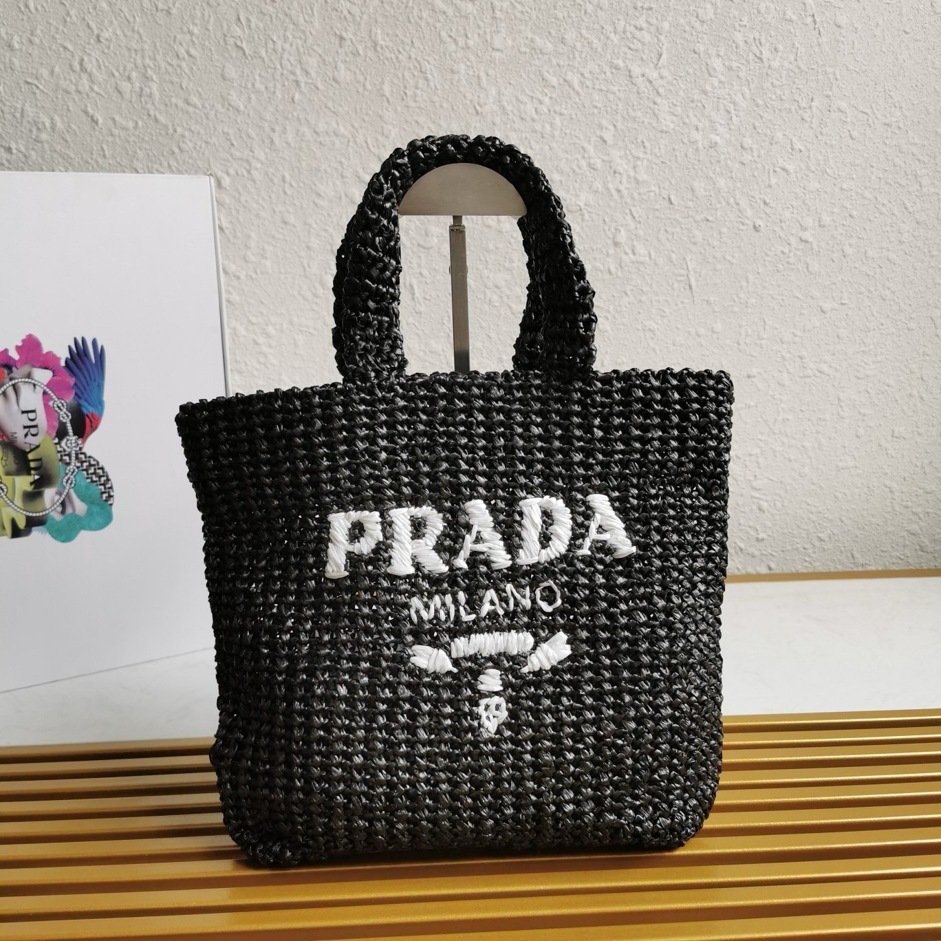 Pra*a small crochet tote bag in black raffia-effect yarn