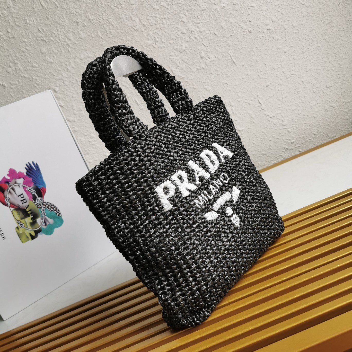 Pra*a small crochet tote bag in black raffia-effect yarn