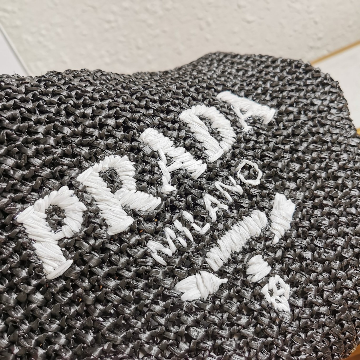 Pra*a small crochet tote bag in black raffia-effect yarn