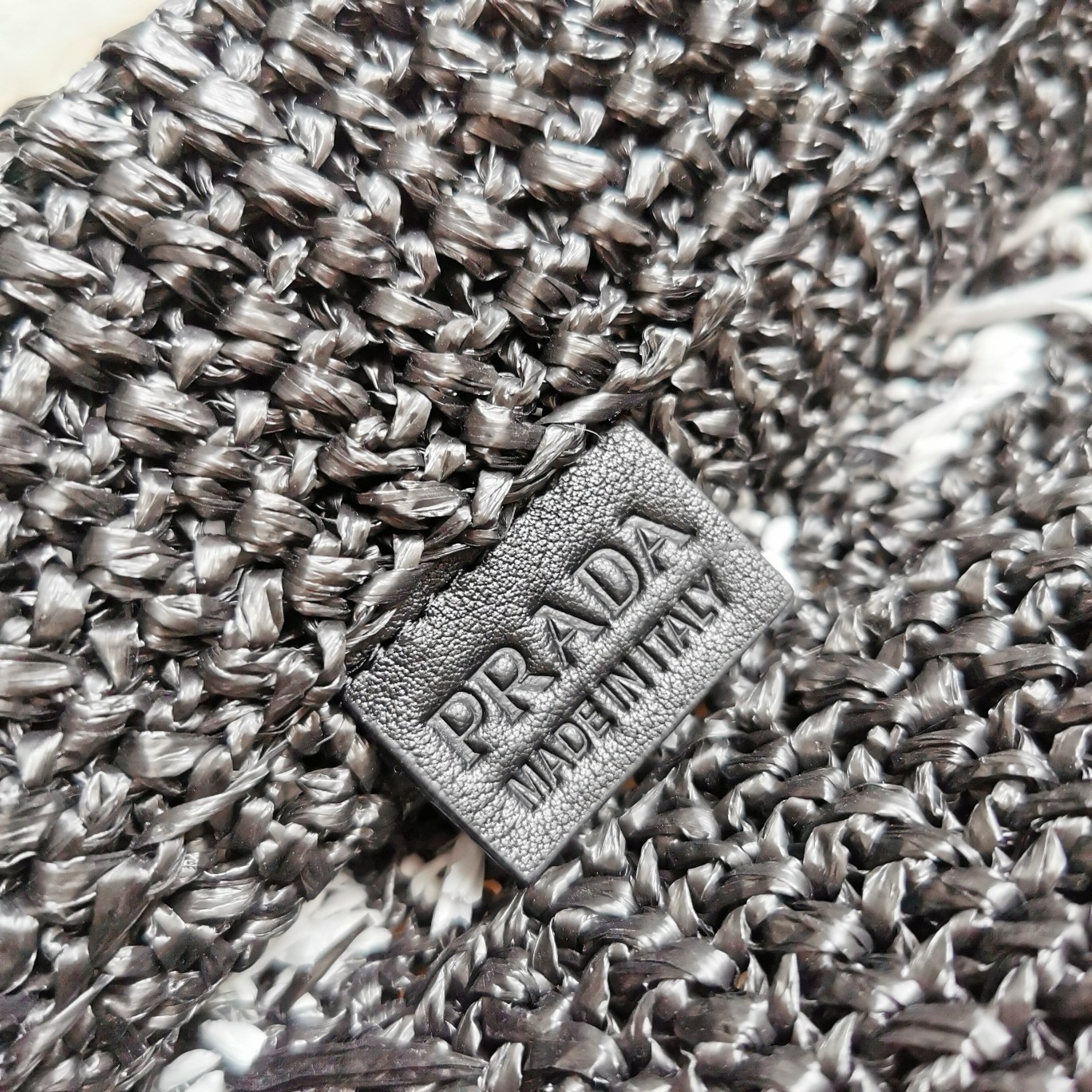 Pra*a small crochet tote bag in black raffia-effect yarn