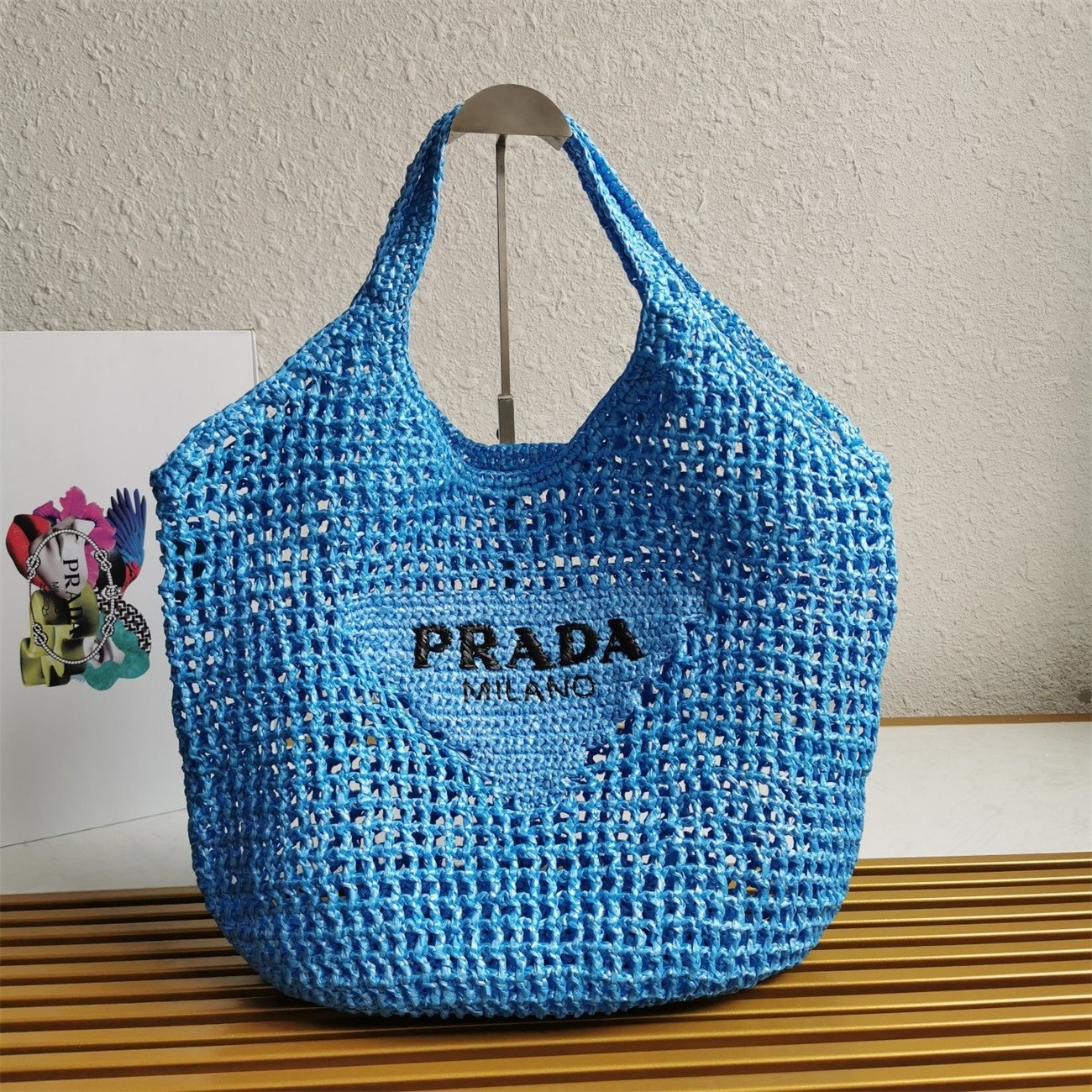 Pra*a large tote bag in blue woven raffia