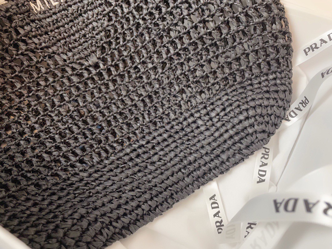 Pra*a large tote bag in black woven raffia