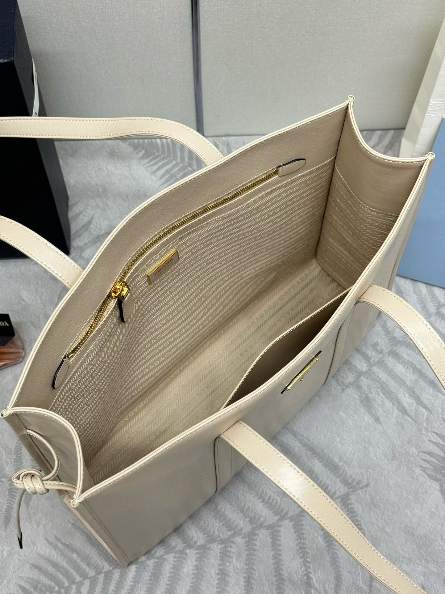 Pra*a large tote bag in beige lambskin