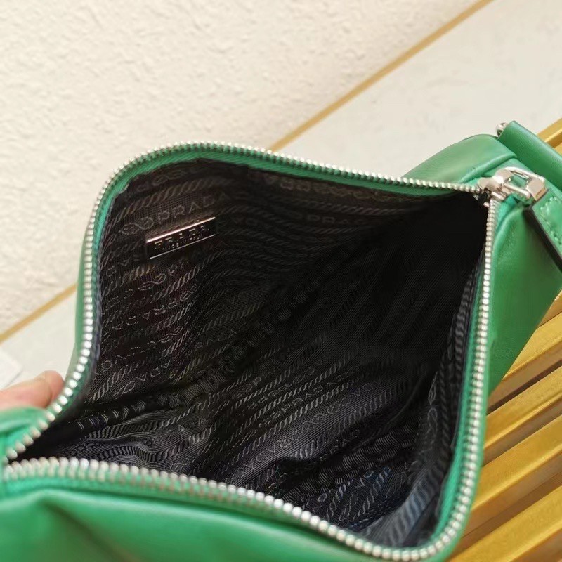 Pra*a triangle shoulder bag in green leather