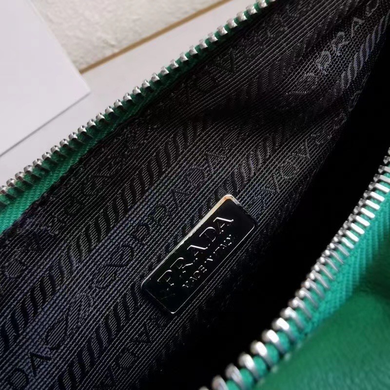 Pra*a triangle shoulder bag in green leather