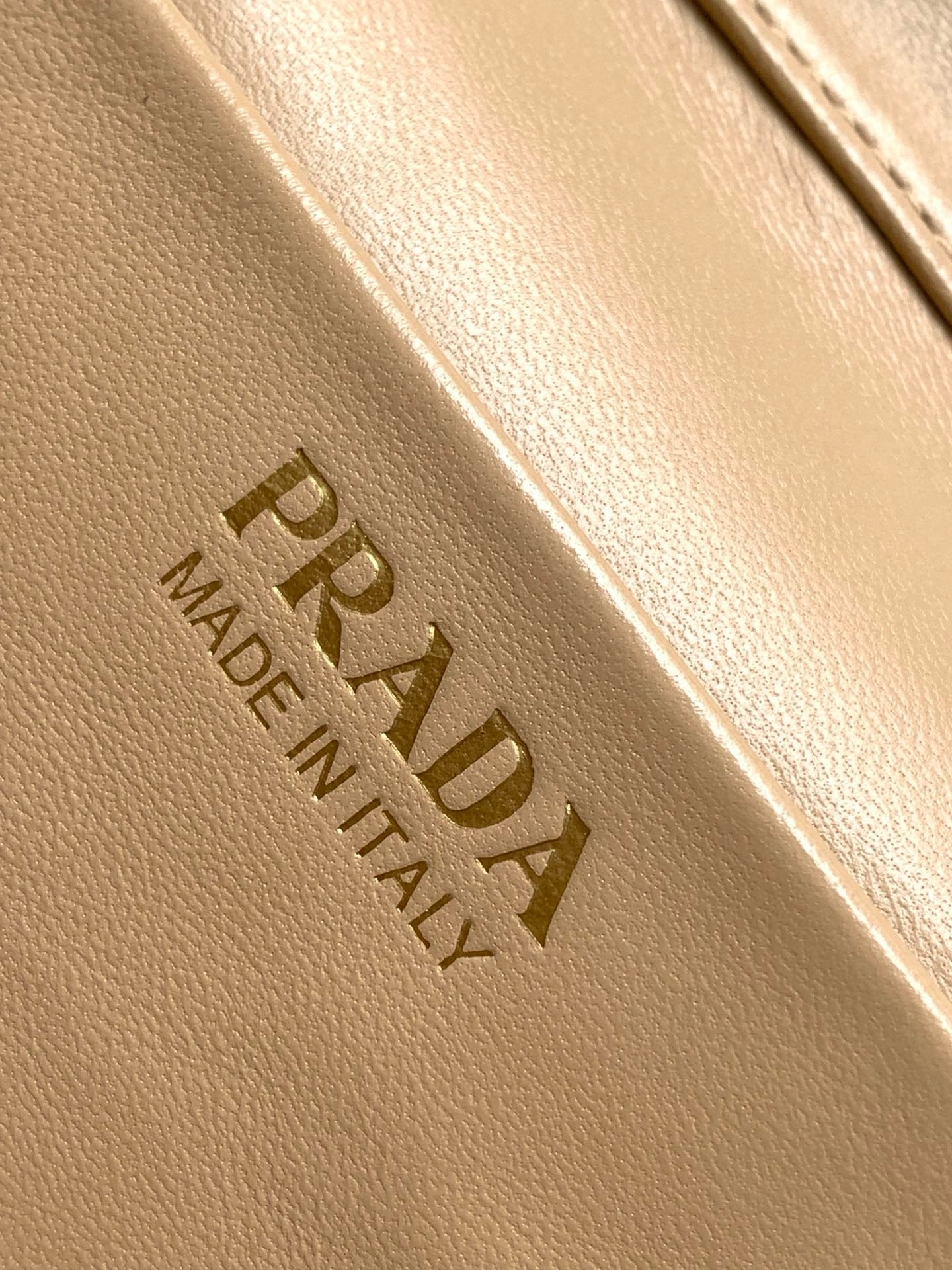 Pra*a mini vanity bag in sand beige grained leather