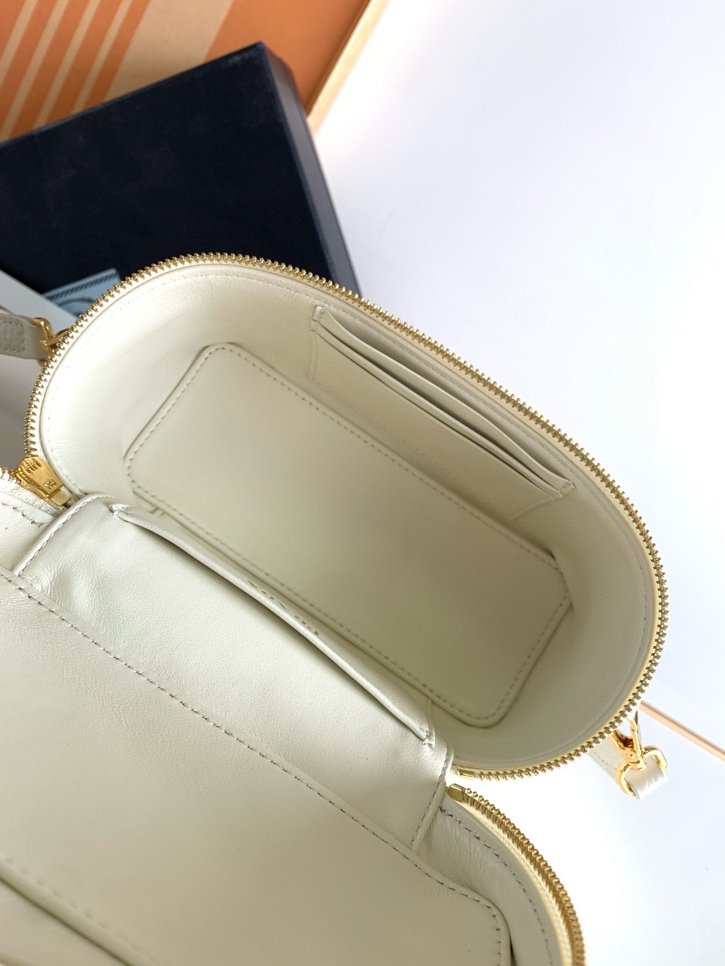 Pra*a mini vanity bag in white grained leather
