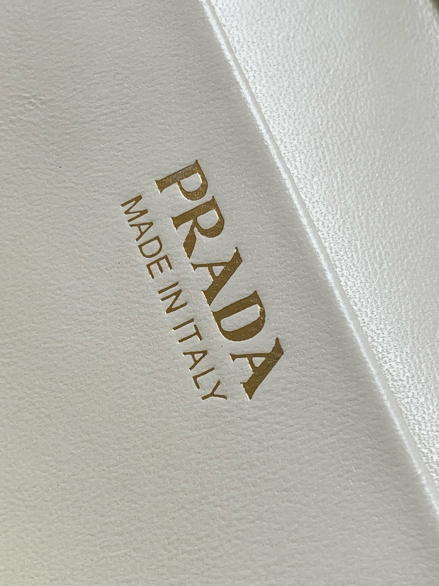 Pra*a mini vanity bag in white grained leather
