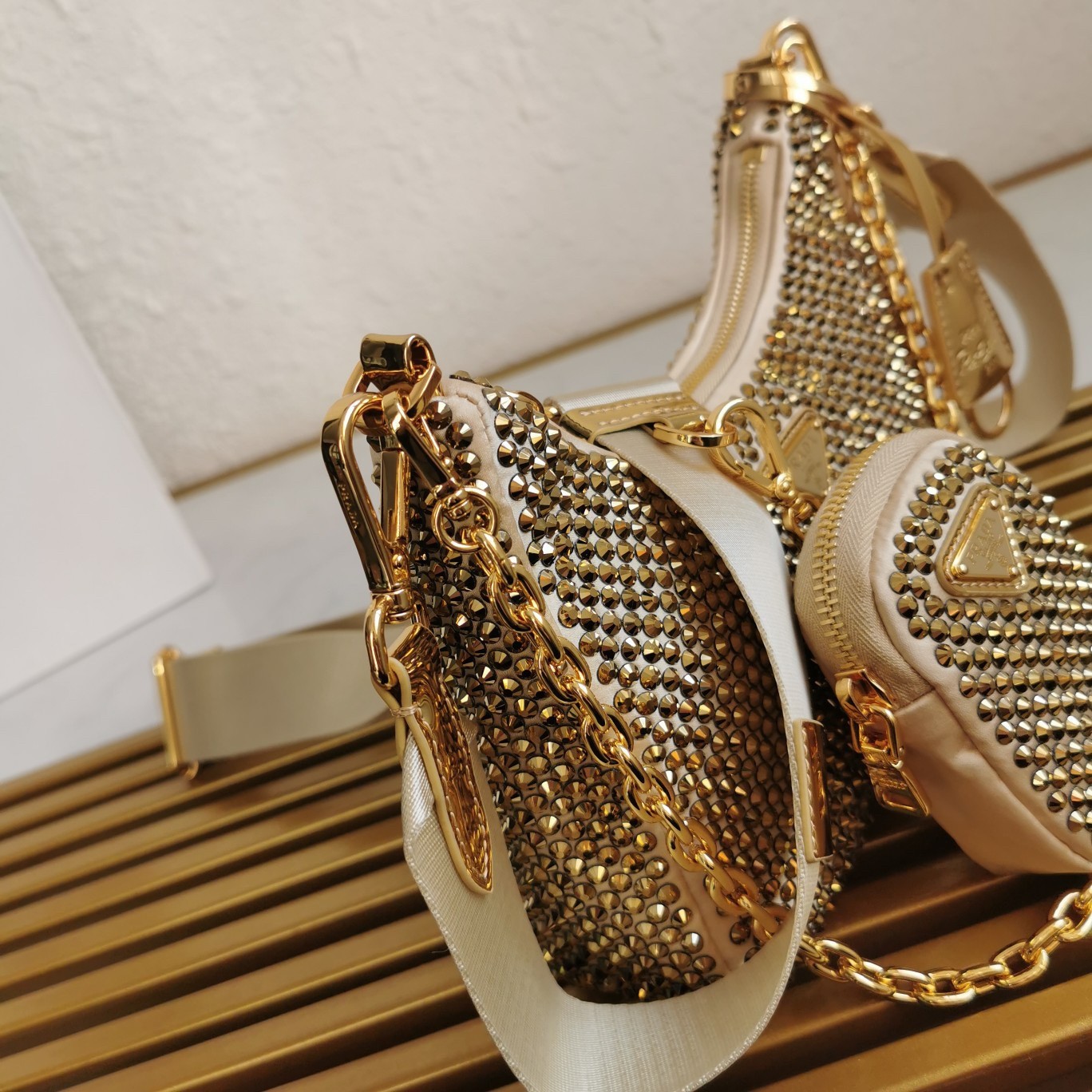 Pra*a re-edition 2005 bag in gold satin with crystal