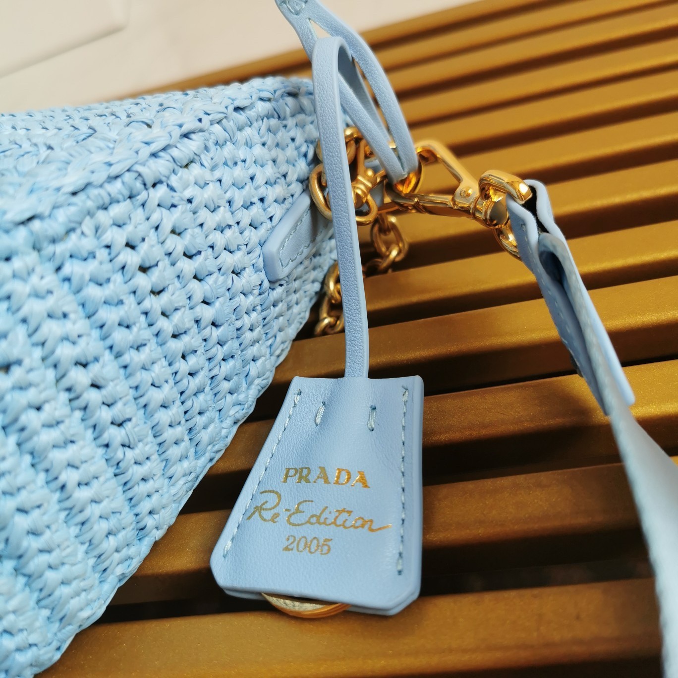 Pra*a re-edition 2005 shoulder bag in blue raffia