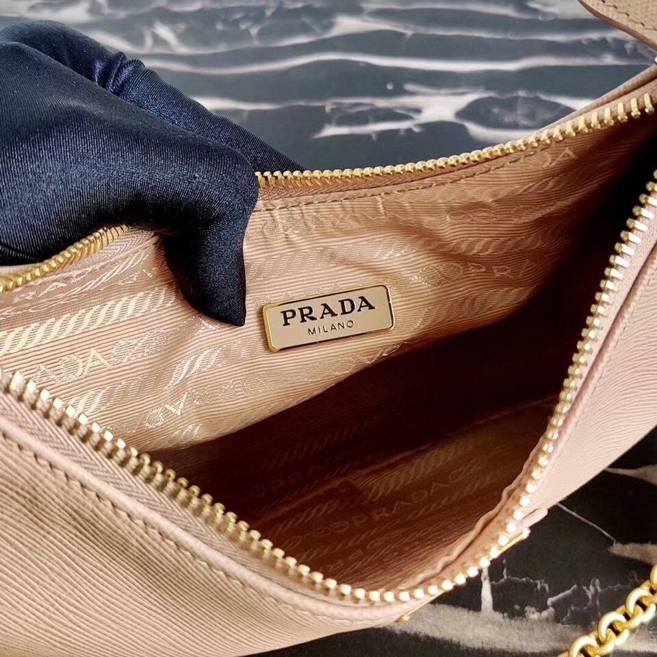 Pra*a re-edition 2005 shoulder bag in beige saffiano leather