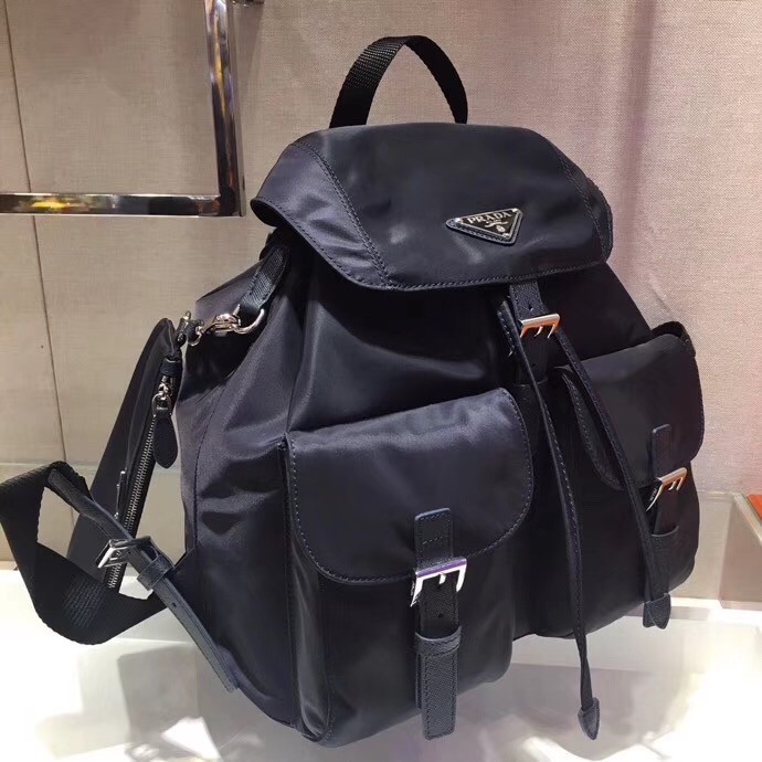 Pra*a navy blue nylon backpack with clutch