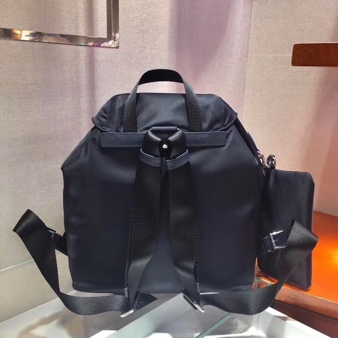 Pra*a navy blue nylon backpack with clutch