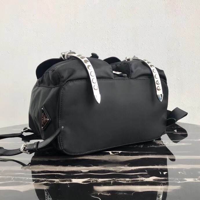 Pra*a black nylon backpack with white metal studs