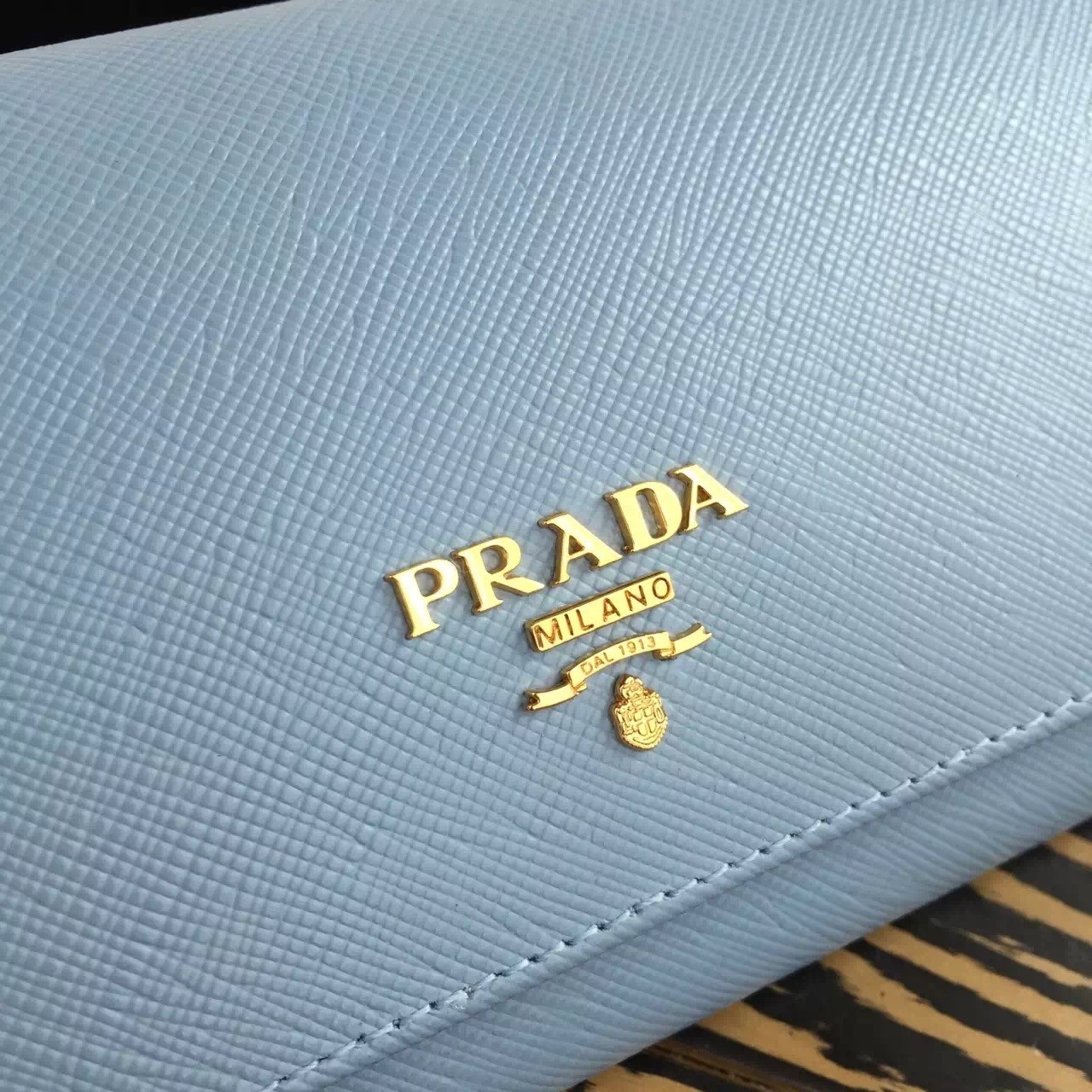 Pra*a continental wallet in light blue saffiano leather