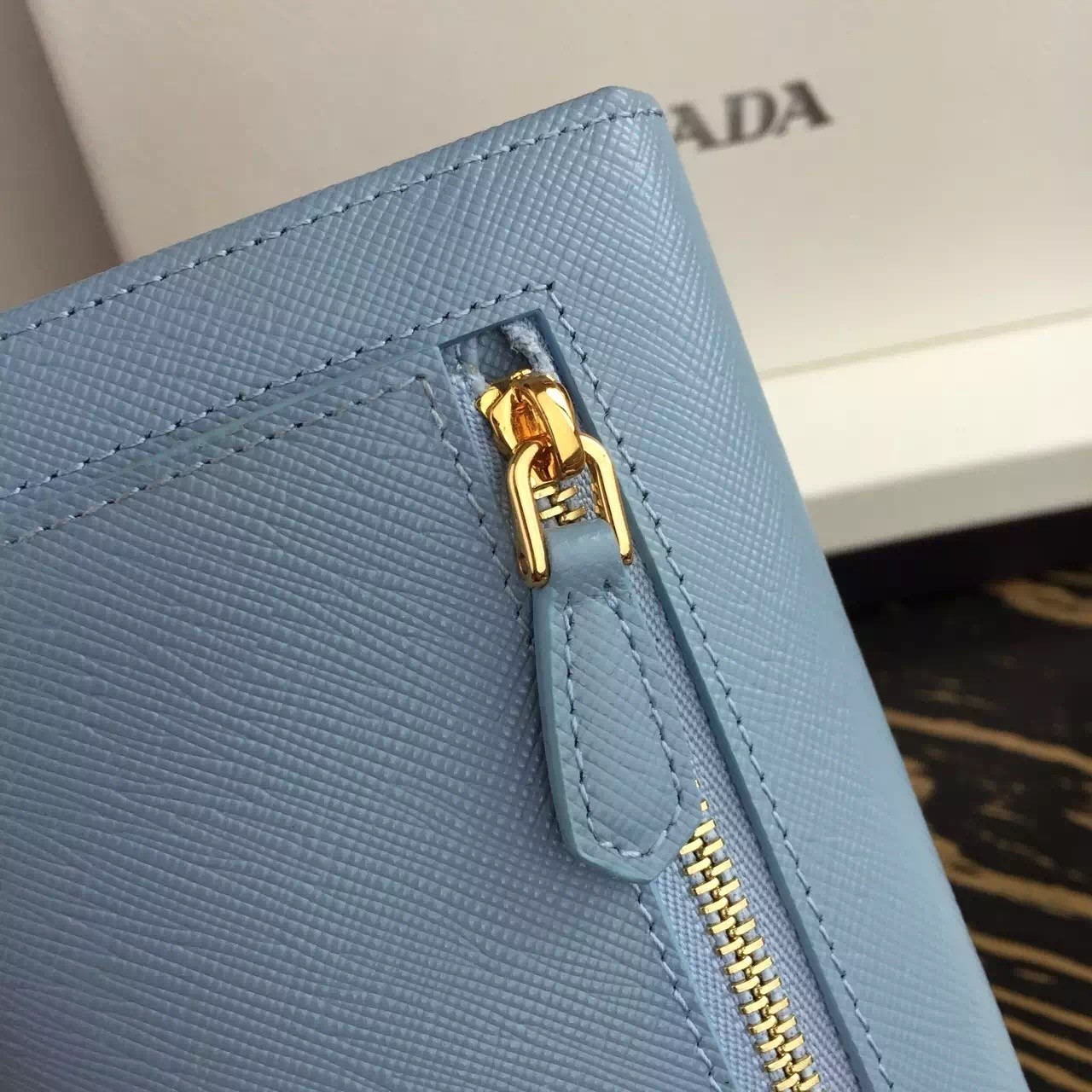 Pra*a continental wallet in light blue saffiano leather