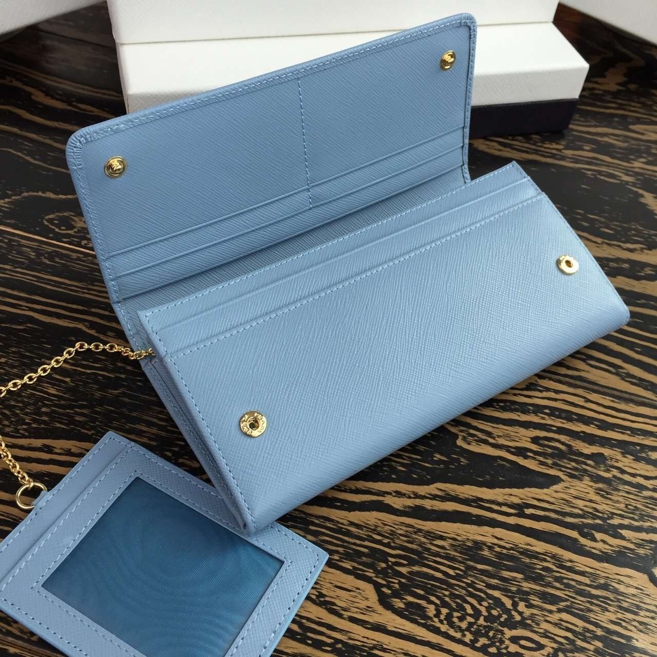 Pra*a continental wallet in light blue saffiano leather