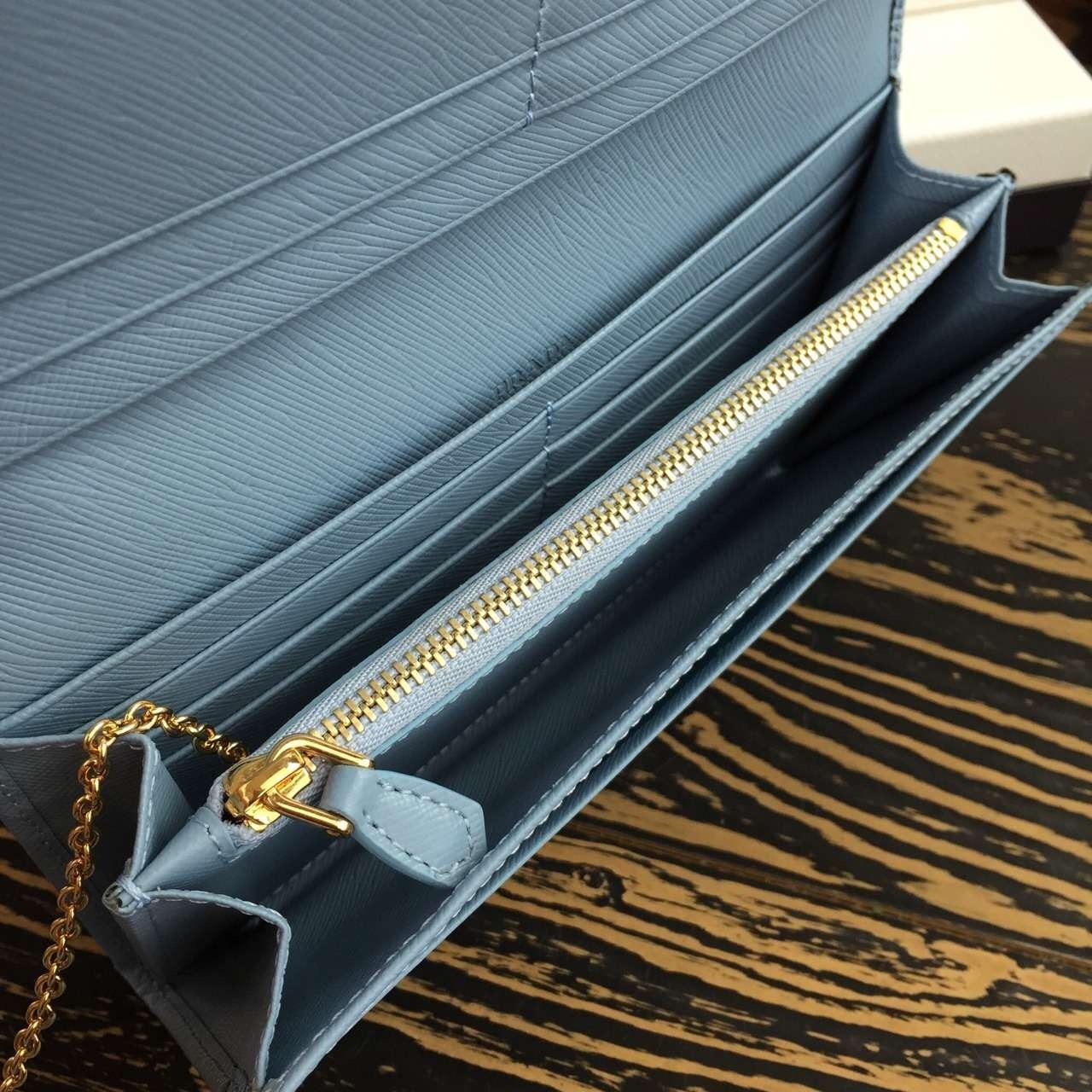 Pra*a continental wallet in light blue saffiano leather