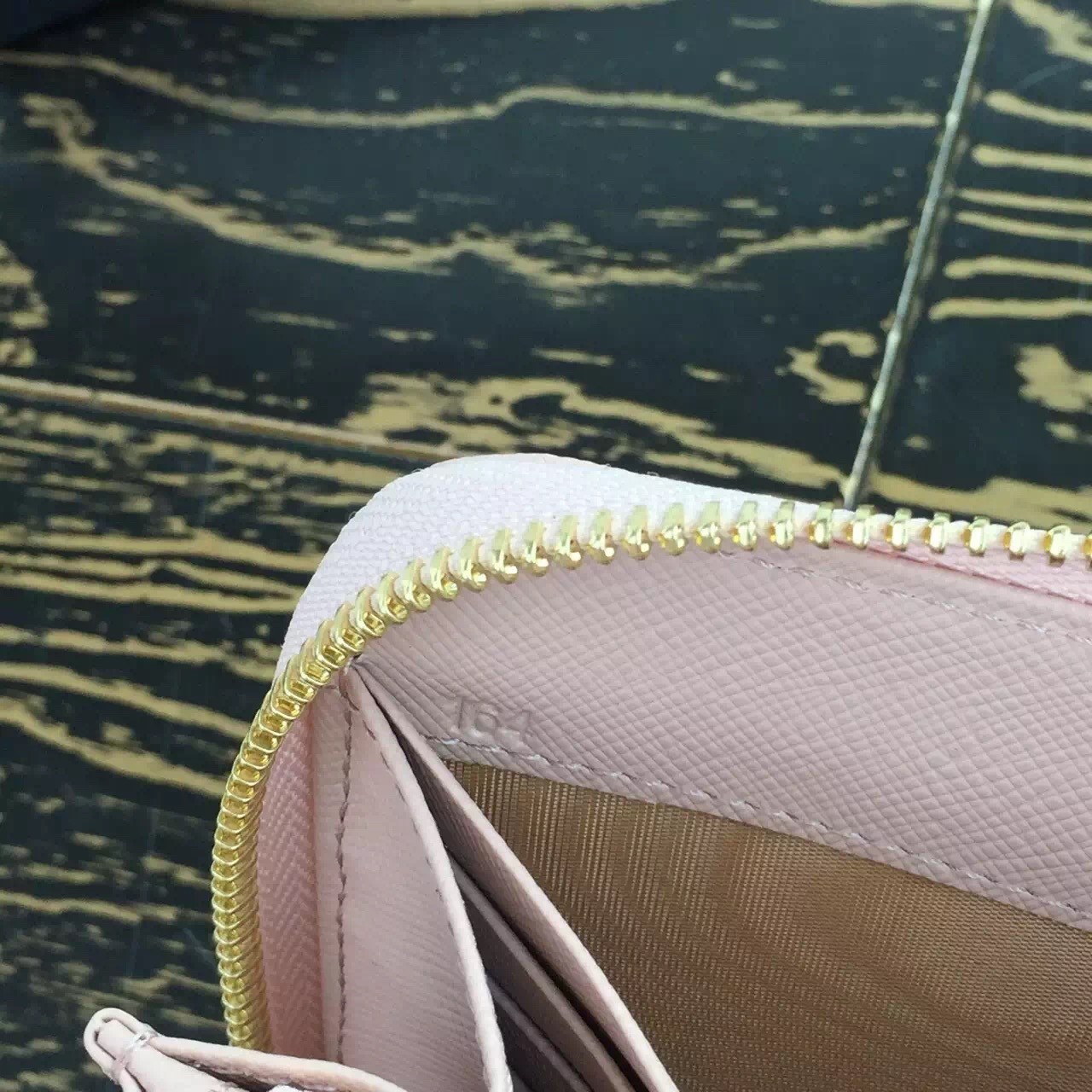 Pra*a zipped wallet in light pink saffiano leather