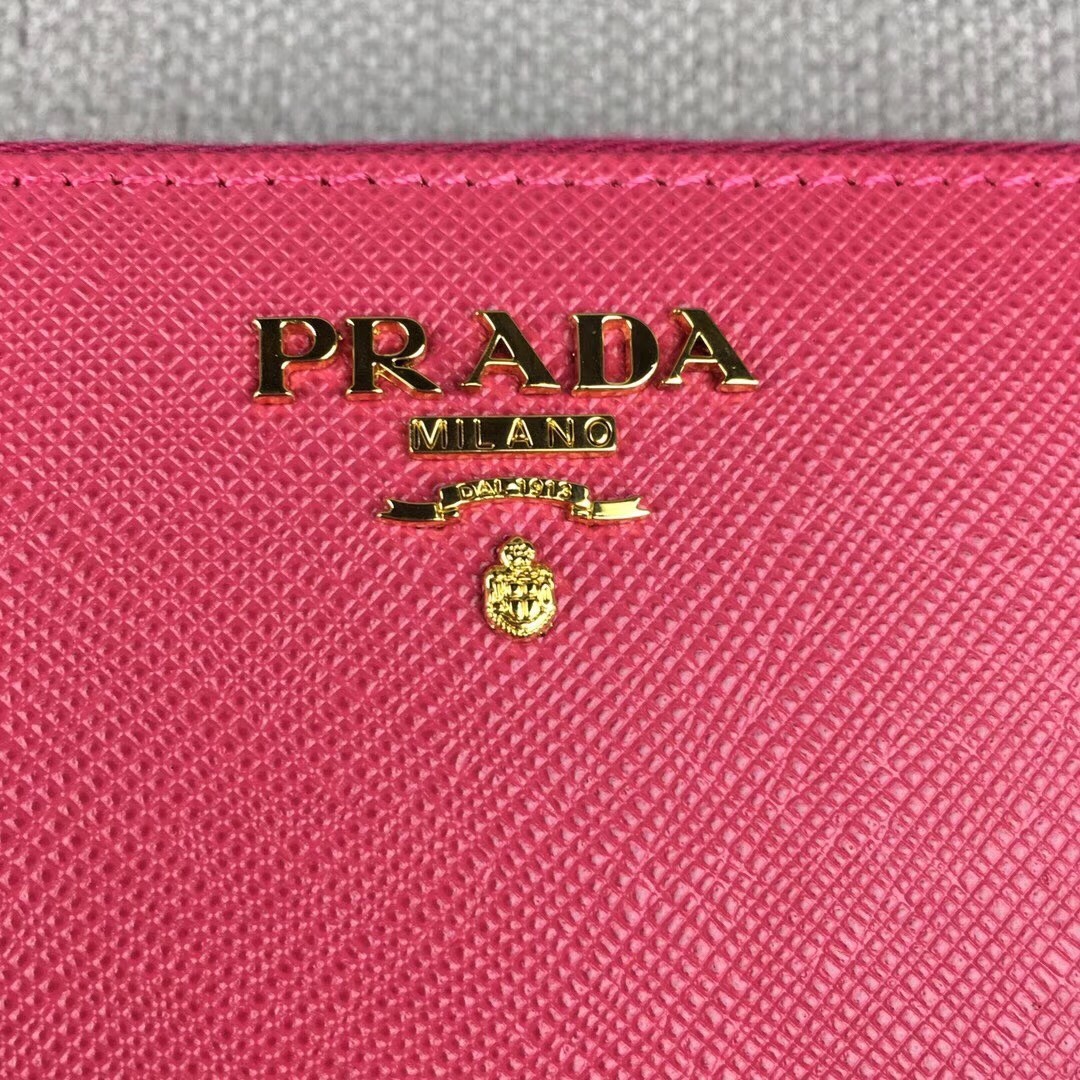 Pra*a zipped wallet in pink saffiano leather