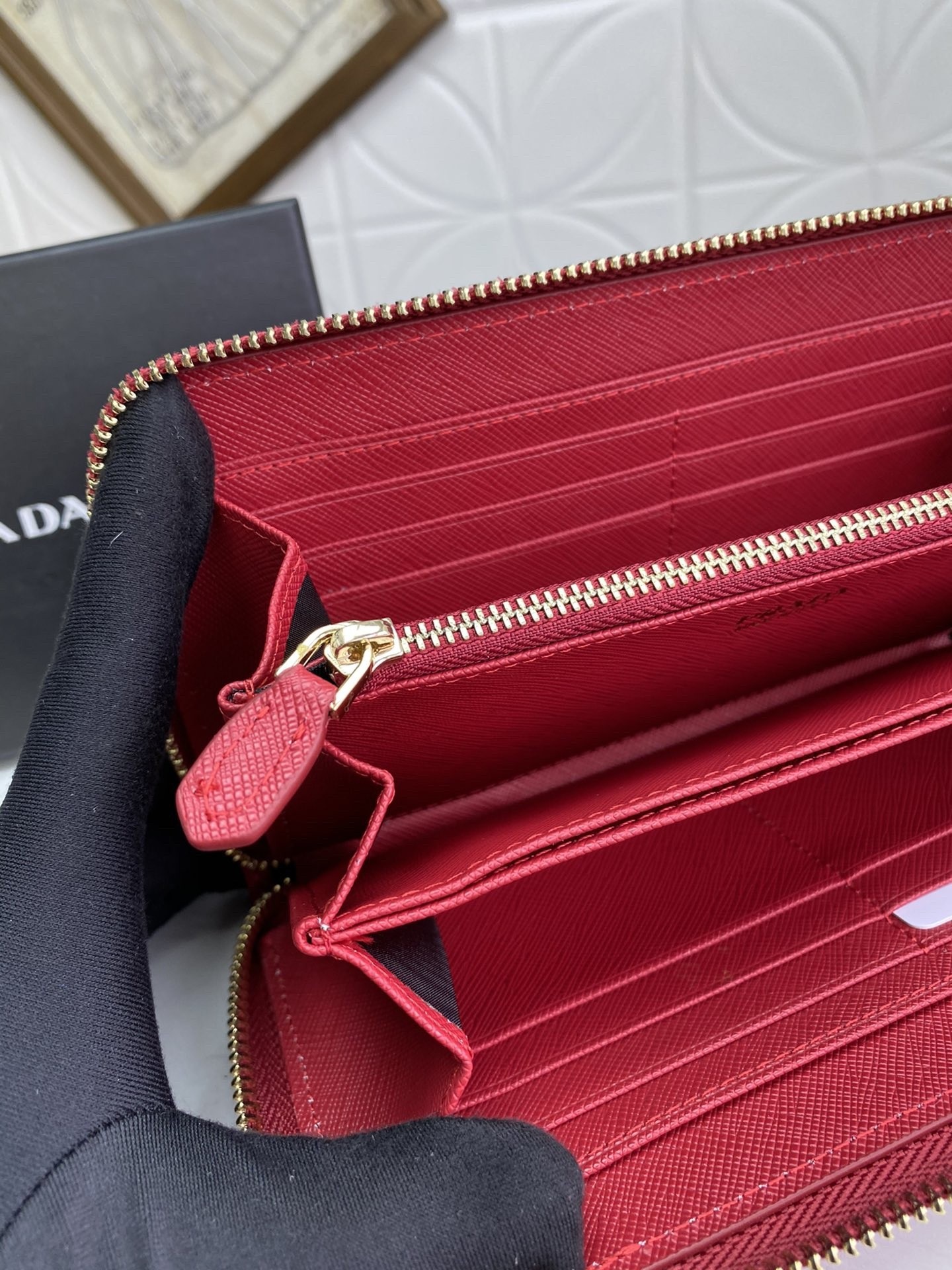 Pra*a zip around wallet in red saffiano calfskin