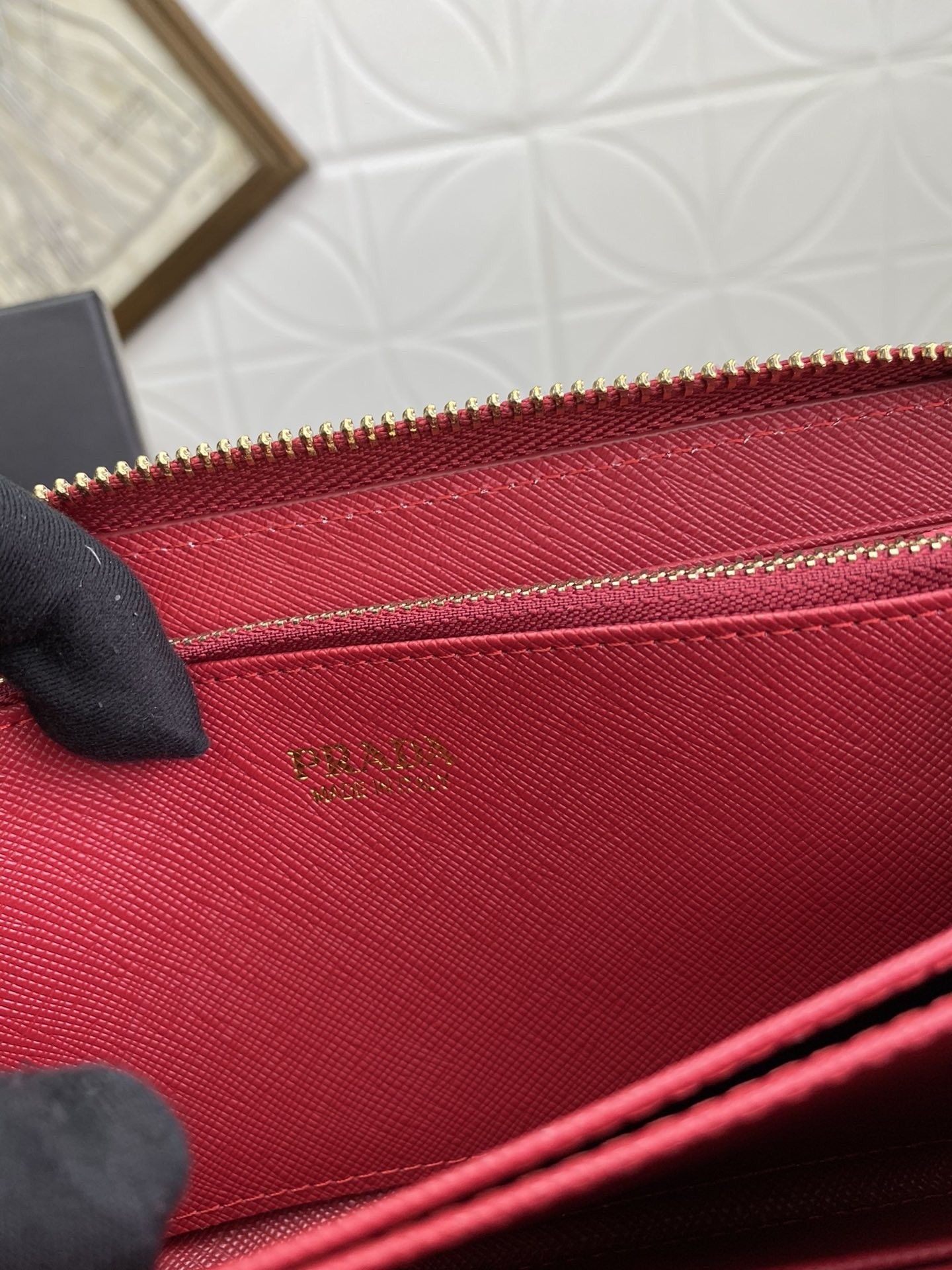 Pra*a zip around wallet in red saffiano calfskin
