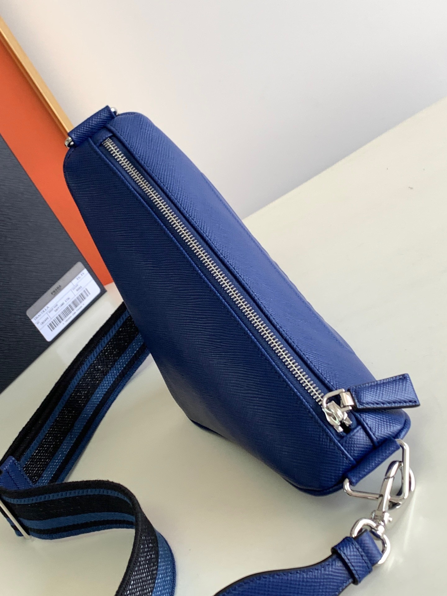 Pra*a triangle shoulder bag in blue saffiano calfskin
