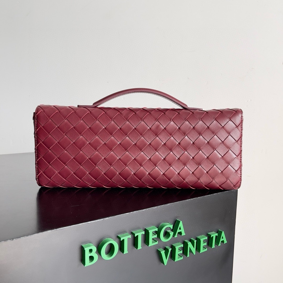 bo*te*ga Ve*ne*ta andiamo clutch with handle in barolo intrecciato lambskin