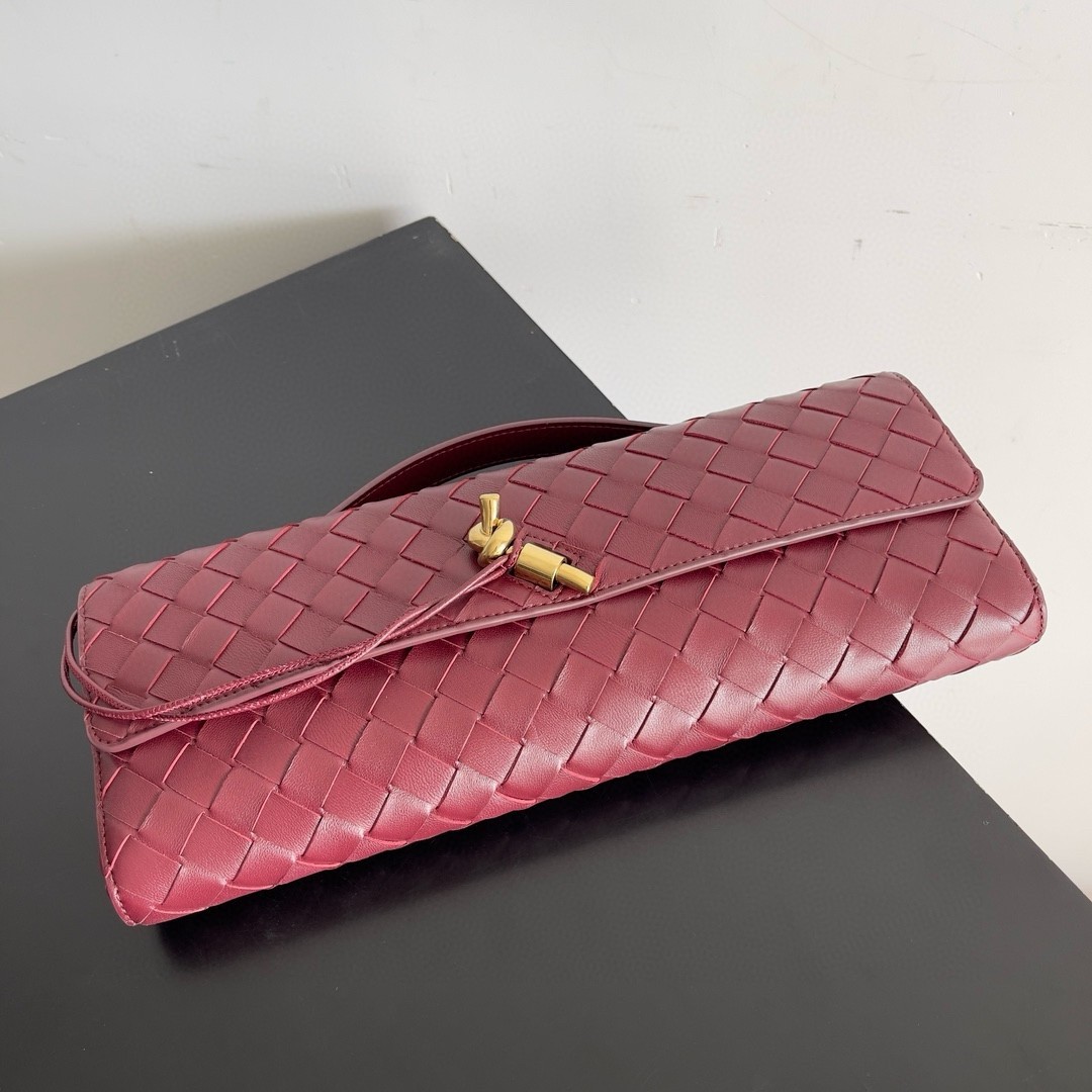 bo*te*ga Ve*ne*ta andiamo clutch with handle in barolo intrecciato lambskin