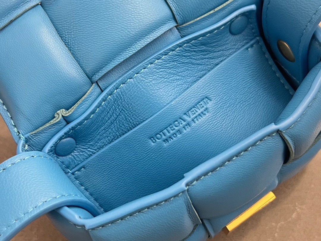 bo*te*ga Ve*ne*ta candy padded cassette bag in pool lambskin