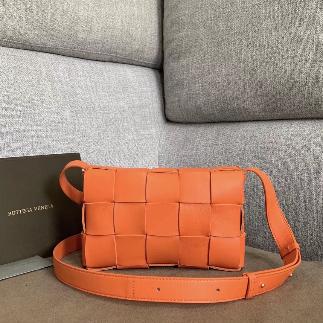 bo*te*ga Ve*ne*ta cassette bag in orange lambskin