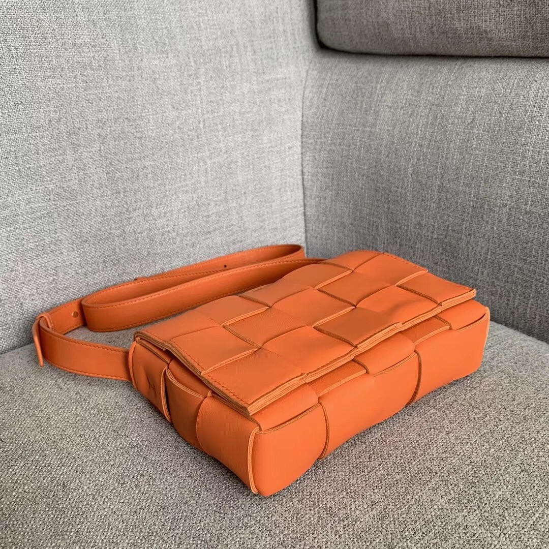 bo*te*ga Ve*ne*ta cassette bag in orange lambskin