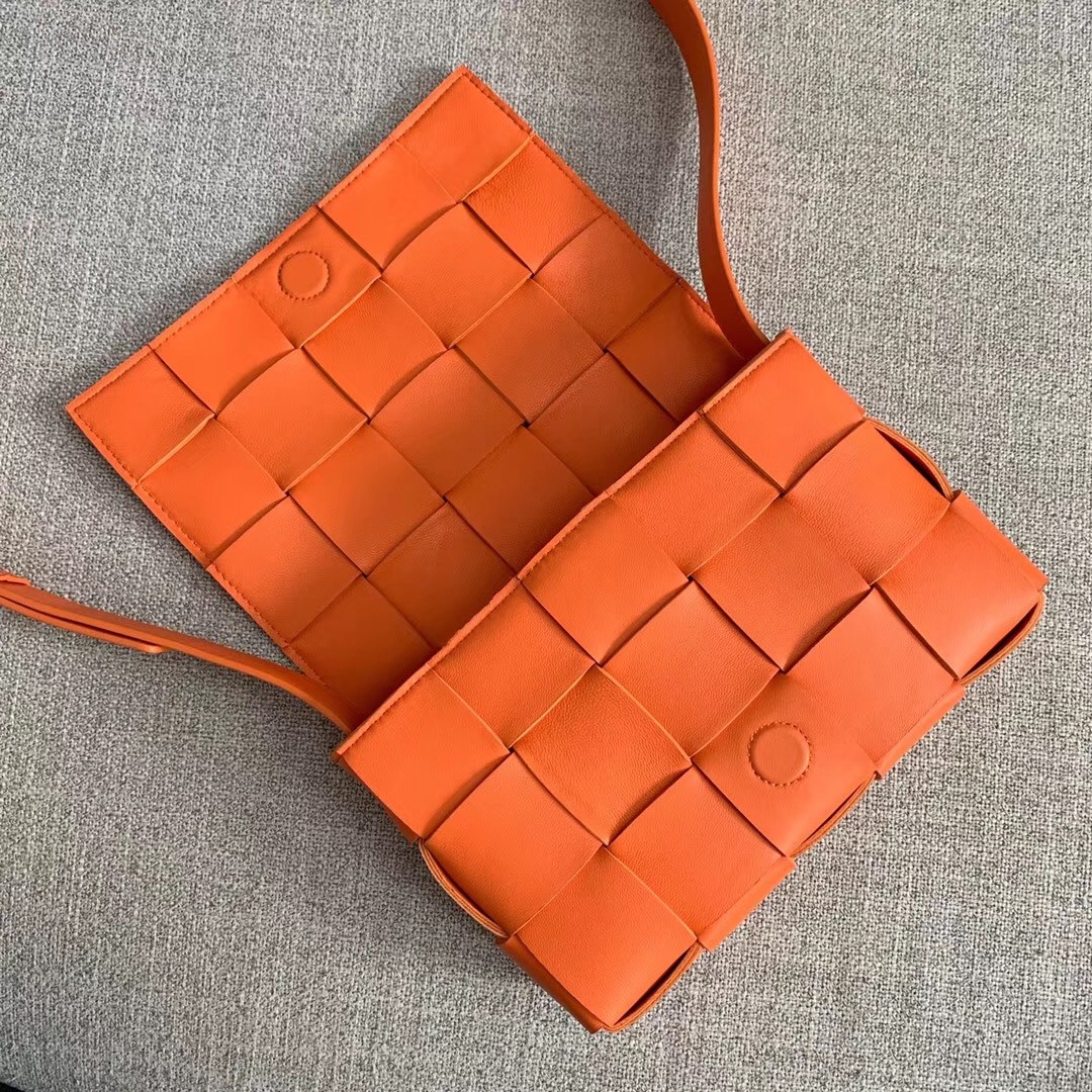bo*te*ga Ve*ne*ta cassette bag in orange lambskin
