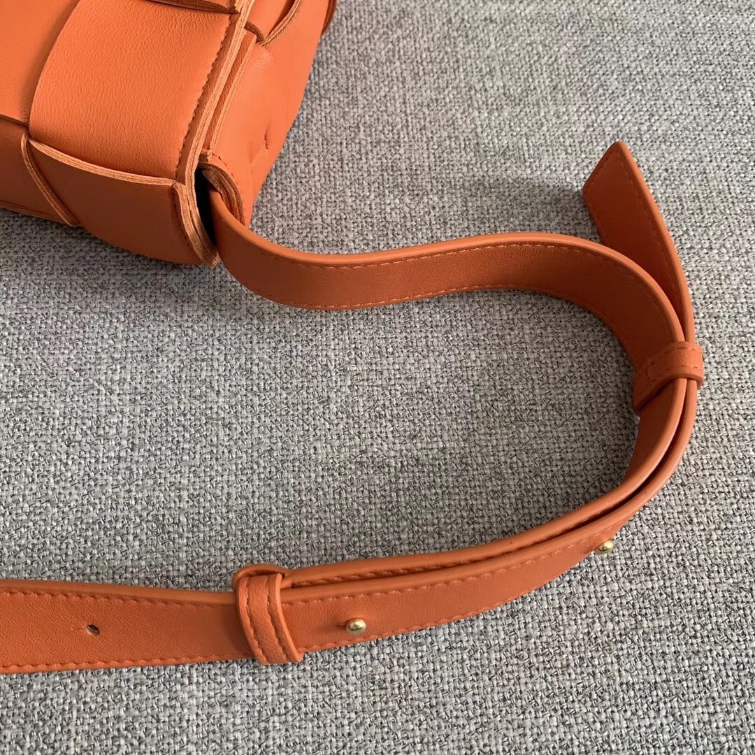 bo*te*ga Ve*ne*ta cassette bag in orange lambskin