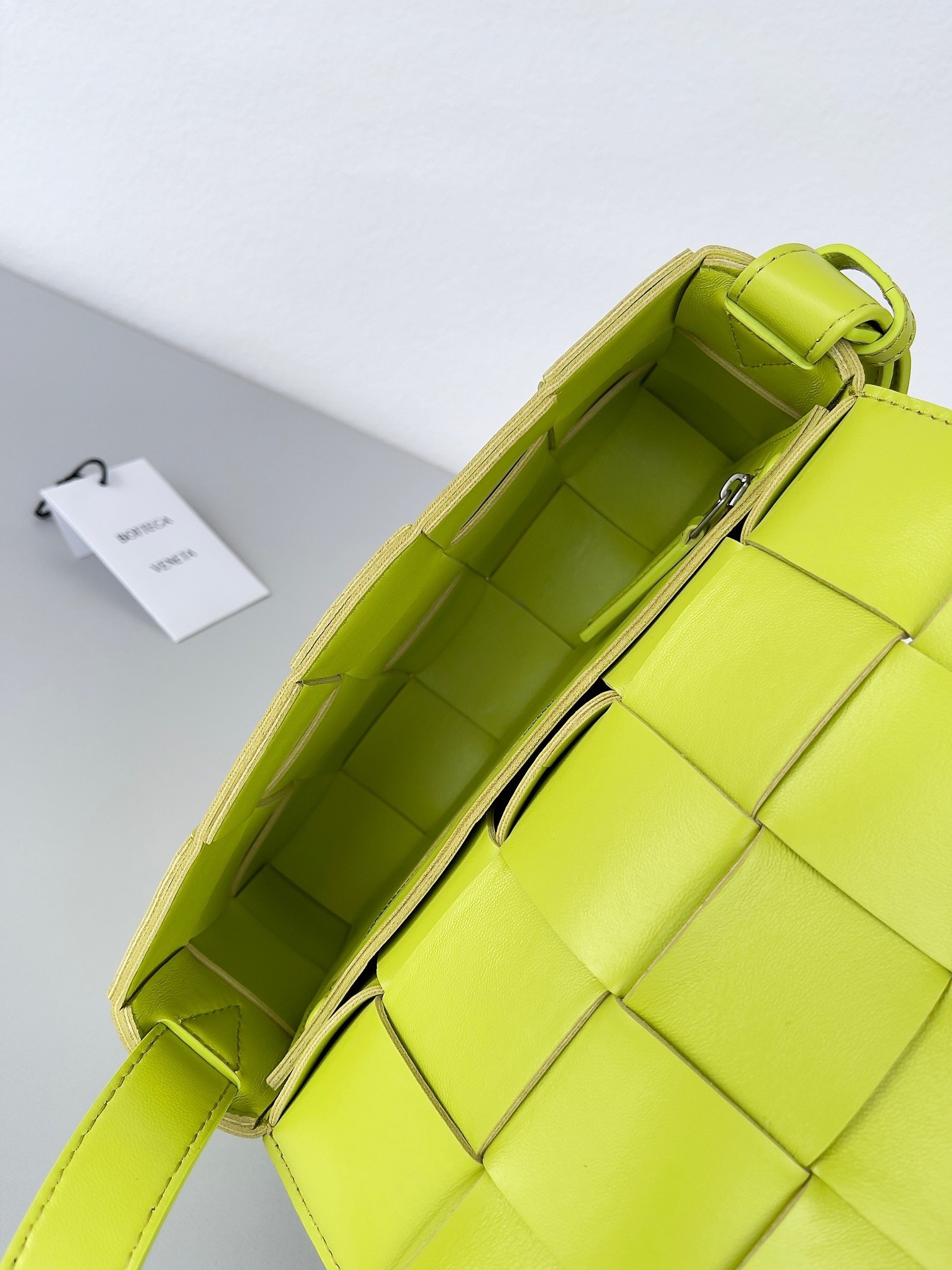 bo*te*ga Ve*ne*ta cassett bag in acid kiwi intrecciato lambskin