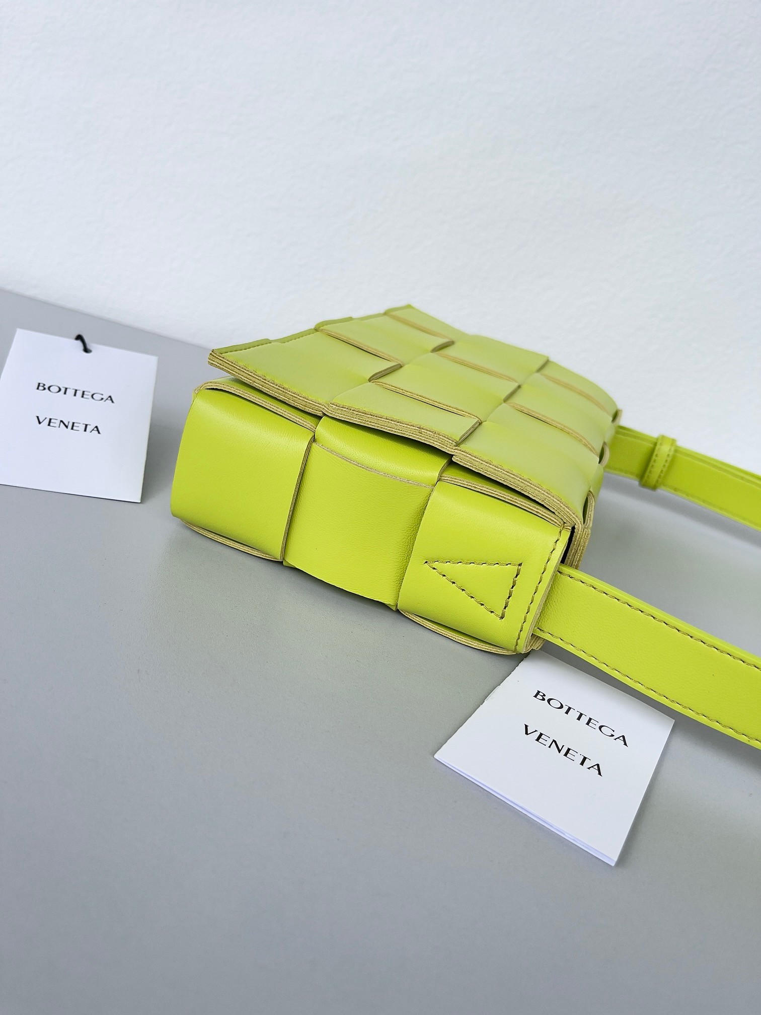 bo*te*ga Ve*ne*ta cassett bag in acid kiwi intrecciato lambskin