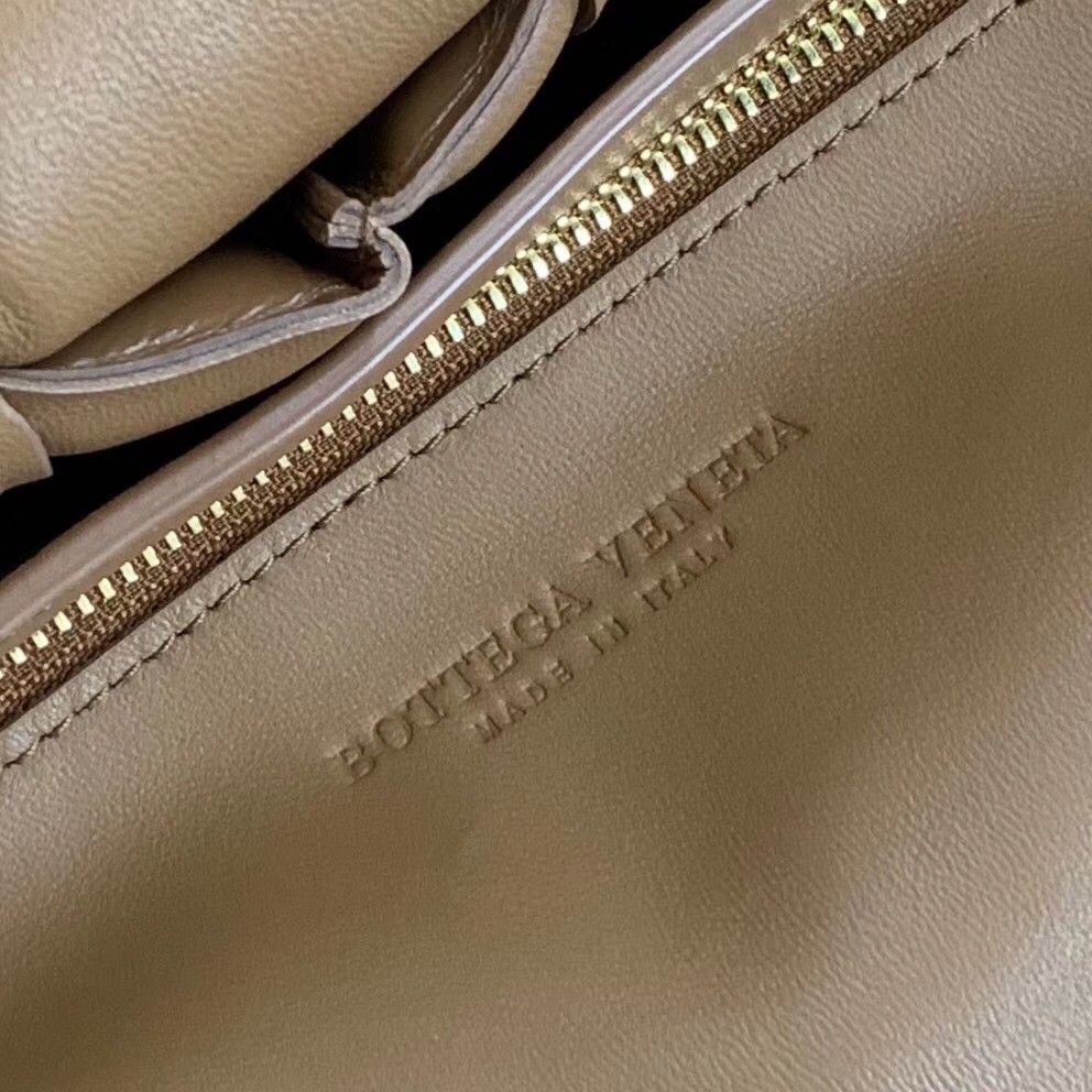 bo*te*ga Ve*ne*ta padded cassette bag in caramel calfskin