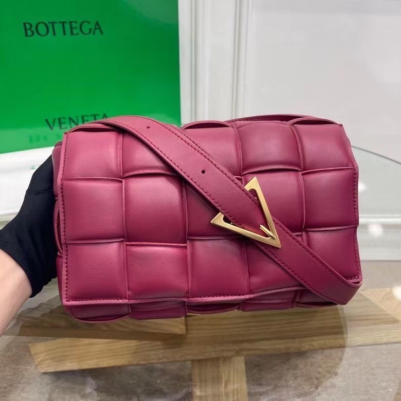 bo*te*ga Ve*ne*ta padded cassette bag in cinnabar calfskin