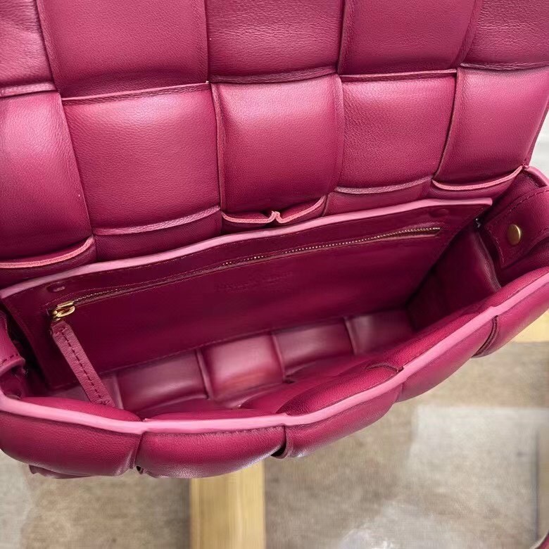 bo*te*ga Ve*ne*ta padded cassette bag in cinnabar calfskin