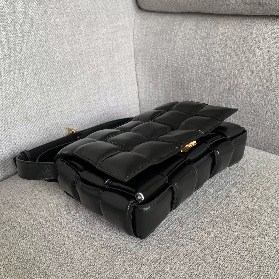 bo*te*ga Ve*ne*ta padded cassette bag in black calfskin