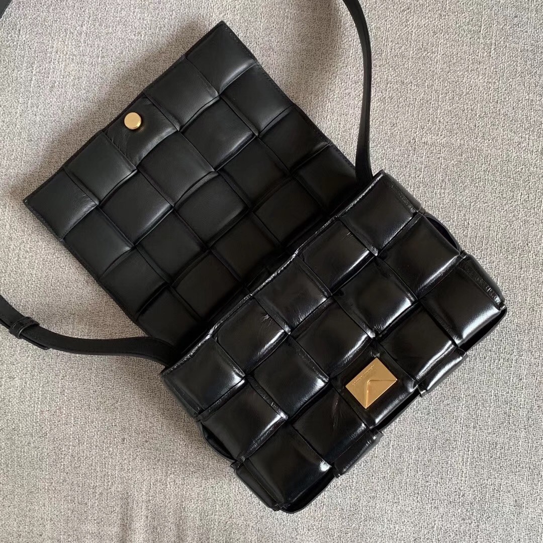 bo*te*ga Ve*ne*ta padded cassette bag in black calfskin