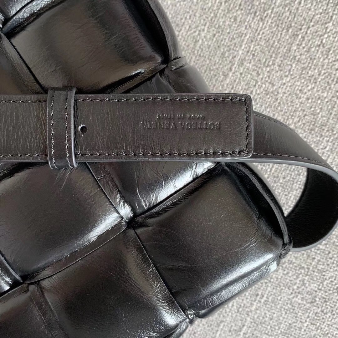 bo*te*ga Ve*ne*ta padded cassette bag in black calfskin
